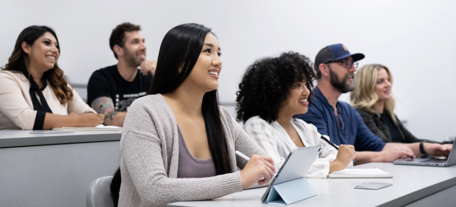 A diverse group of students taking in a lecture.